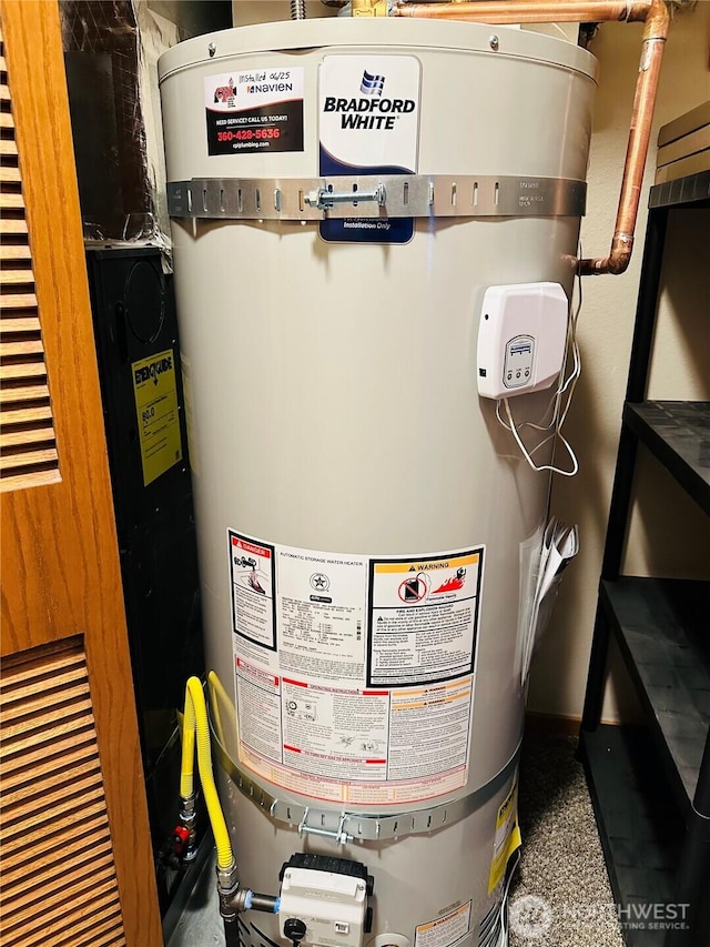 651 SE Bayshore Dr Unit B304, Oak Harbor, WA 98277 - utility room with secured water heater and a heating unit