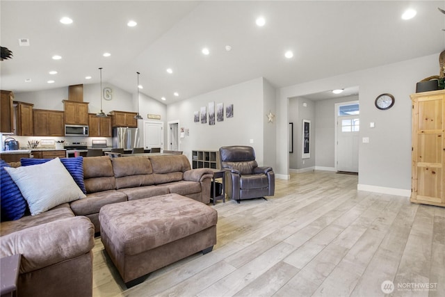 living room featuring high vaulted ceiling, light wood-type flooring, baseboards, and recessed lighting