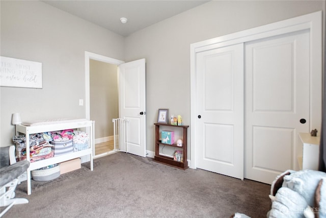 interior space with baseboards and carpet flooring