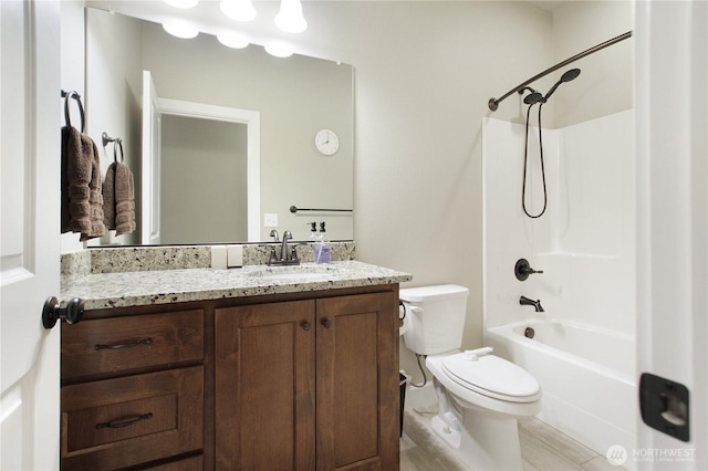 full bathroom with toilet,  shower combination, and vanity