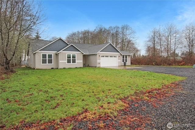 view of front of property with a garage, aphalt driveway, board and batten siding, and a front lawn