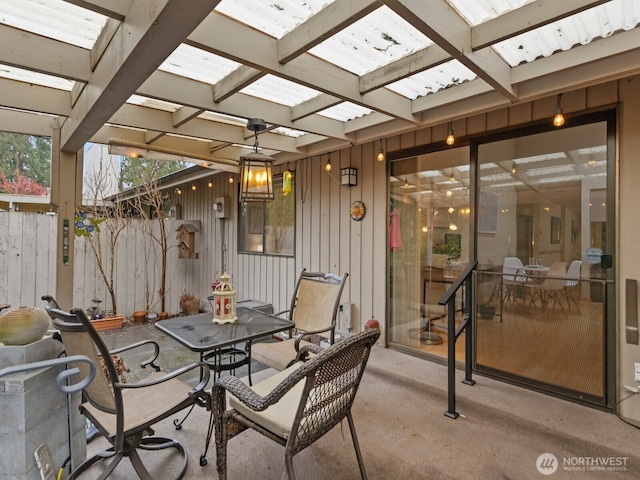 view of patio / terrace with outdoor dining area, fence, and a pergola