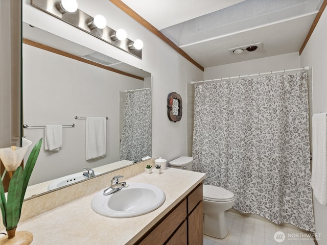 bathroom featuring toilet and vanity