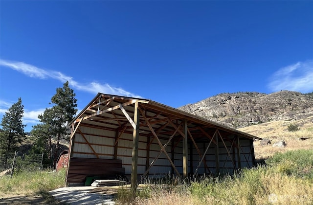 view of pole building with a mountain view