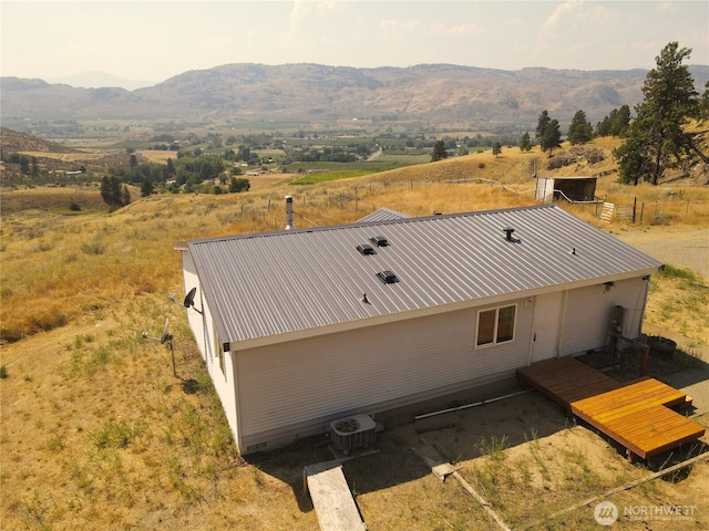 drone / aerial view featuring a rural view and a mountain view