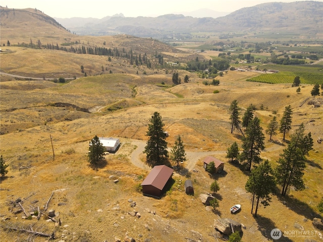 drone / aerial view with a mountain view and a rural view