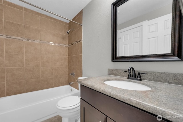 bathroom featuring  shower combination, toilet, and vanity