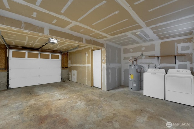 garage featuring water heater, a garage door opener, and washer and dryer