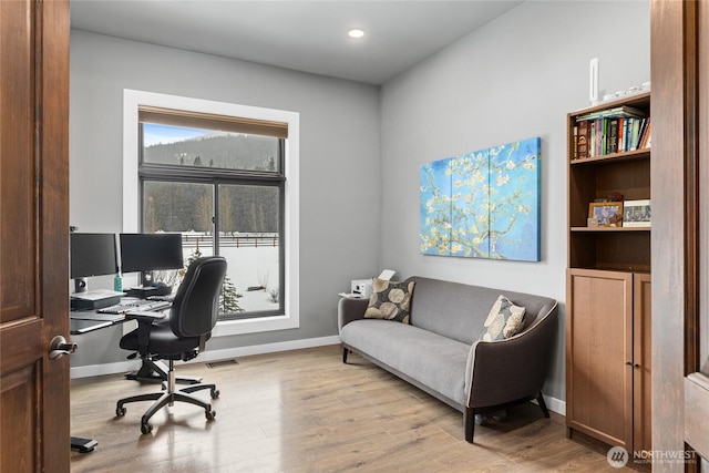 office space featuring visible vents, baseboards, wood finished floors, and recessed lighting