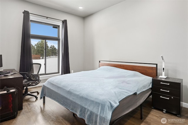 bedroom featuring recessed lighting, baseboards, and wood finished floors