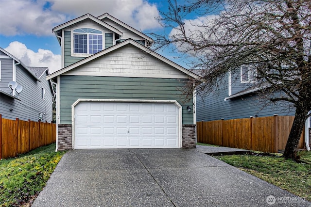 view of front of house featuring a garage, fence, concrete driveway, and brick siding