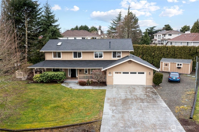 view of front of property featuring concrete driveway, a storage unit, an outdoor structure, a porch, and a front yard