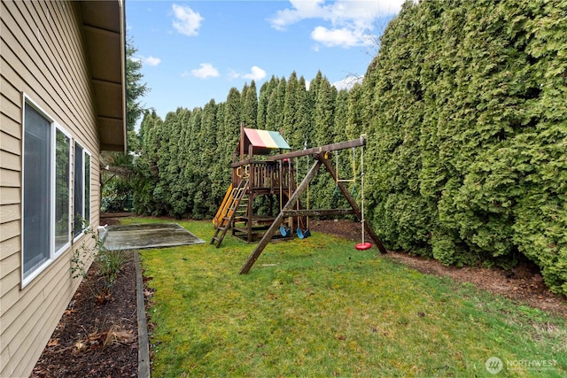 view of playground with a yard