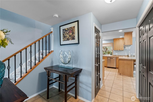 interior space with baseboards and tile patterned floors