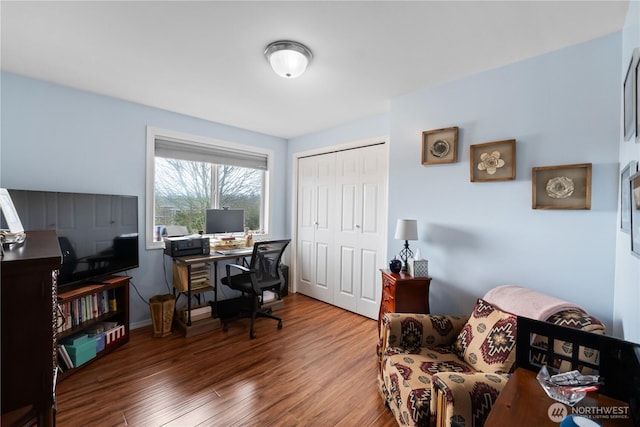 office space with dark wood-style floors and baseboards