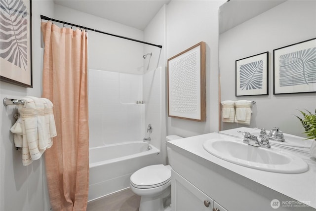 bathroom with shower / bath combination with curtain, vanity, and toilet