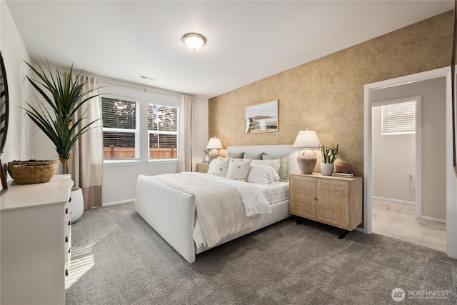 bedroom with carpet flooring, visible vents, and baseboards