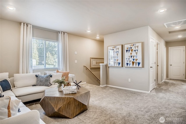 living area with carpet, visible vents, baseboards, and recessed lighting