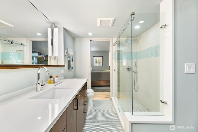 full bathroom featuring a stall shower, toilet, ensuite bath, vanity, and recessed lighting