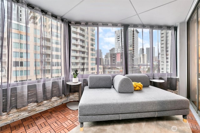 sitting room with expansive windows and a city view