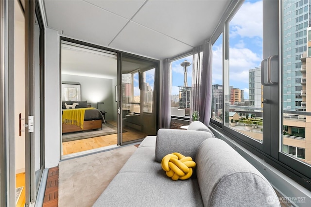 sunroom / solarium featuring a city view