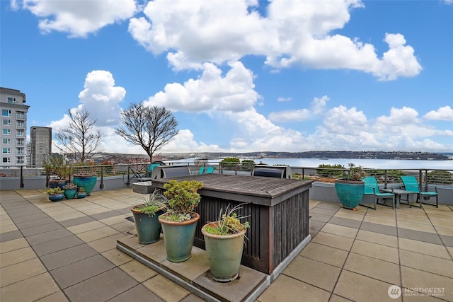 view of patio featuring a water view