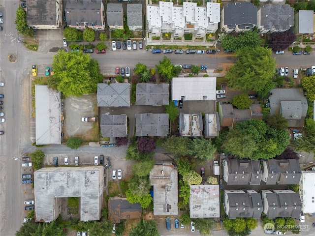 birds eye view of property with a residential view