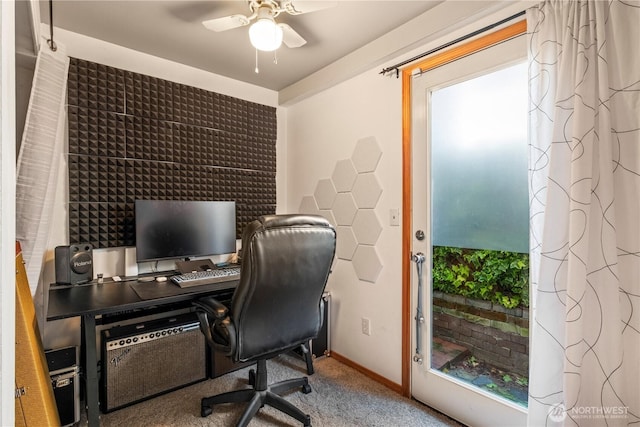 home office featuring carpet floors, baseboards, and a ceiling fan