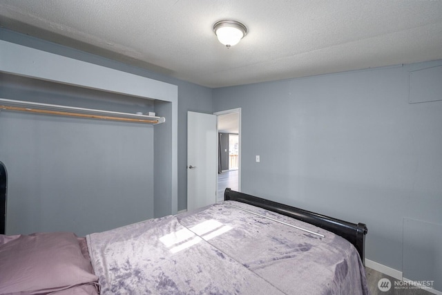 bedroom featuring a textured ceiling