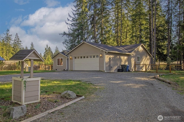 exterior space with fence and driveway