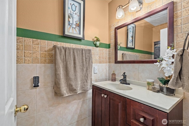 bathroom featuring tile walls and vanity