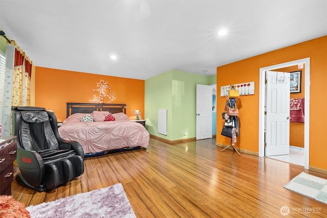 bedroom featuring recessed lighting, wood finished floors, and baseboards