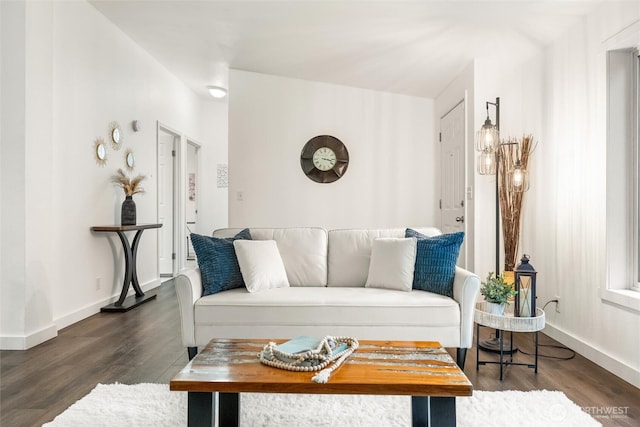 living room with baseboards and wood finished floors