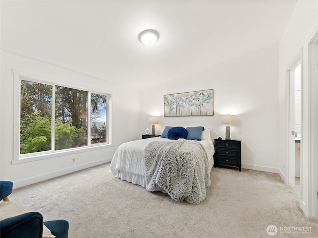 bedroom featuring carpet and baseboards