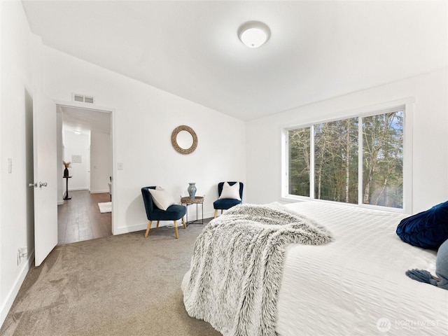 bedroom with light carpet, baseboards, and visible vents