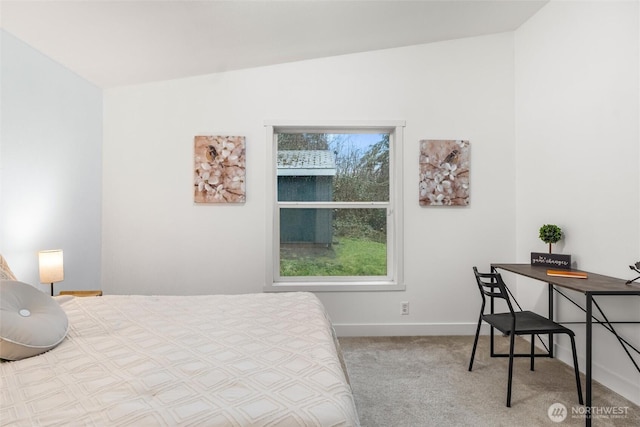 carpeted bedroom featuring baseboards