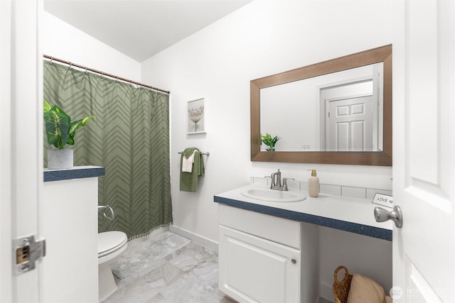 bathroom featuring marble finish floor, a shower with shower curtain, toilet, vanity, and baseboards