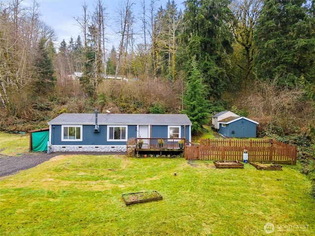 view of front of property featuring a front yard, crawl space, and a wooden deck