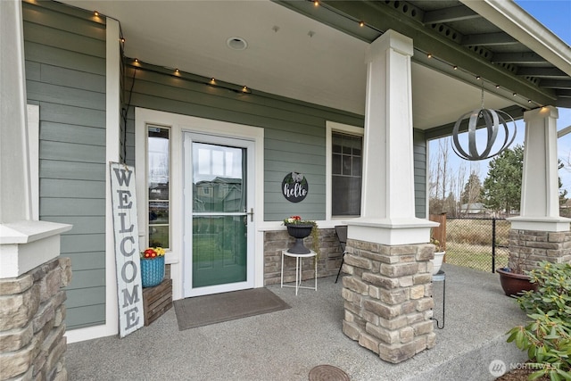 view of patio / terrace with covered porch and fence