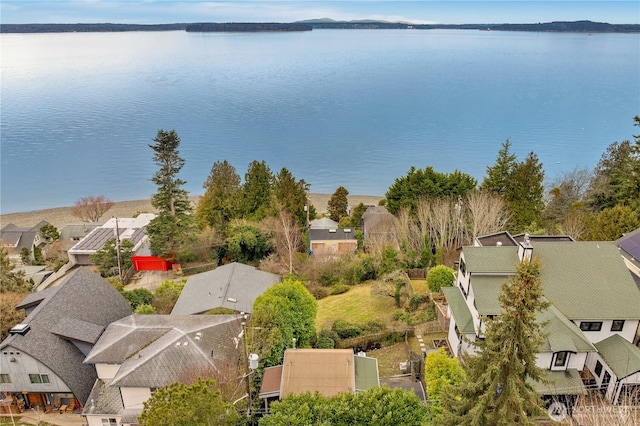 birds eye view of property with a water view and a residential view