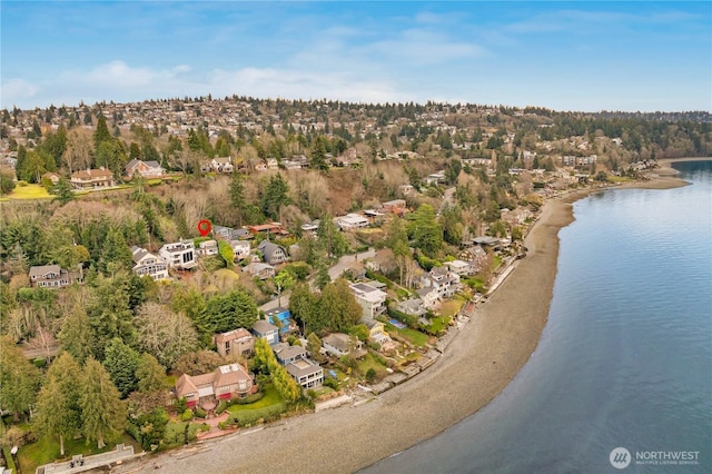 birds eye view of property with a residential view and a water view