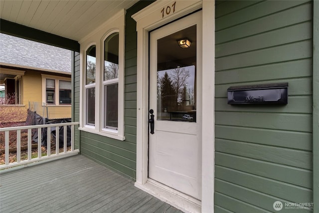 property entrance featuring covered porch