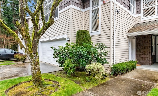 view of side of property with driveway