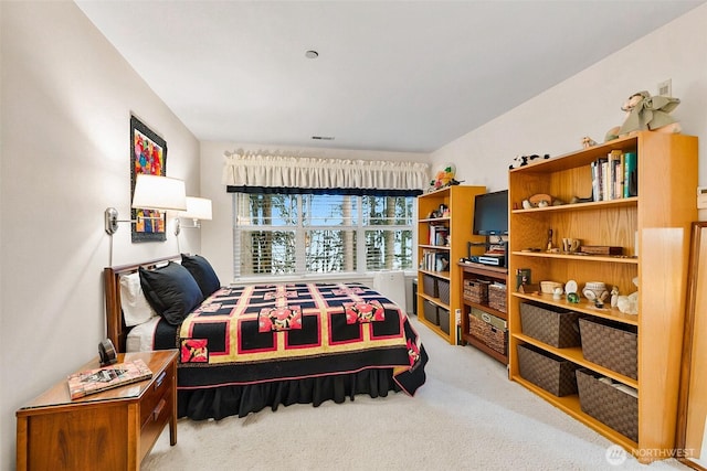 bedroom with light carpet