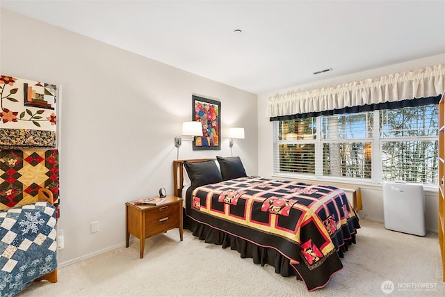 carpeted bedroom featuring multiple windows, visible vents, and baseboards