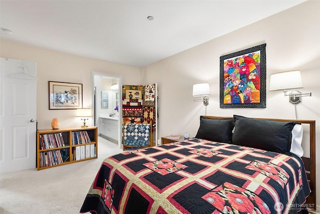 carpeted bedroom featuring connected bathroom