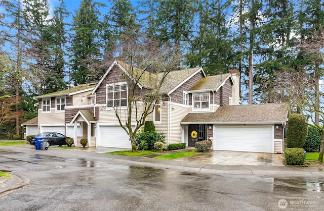 view of front facade featuring concrete driveway and an attached garage