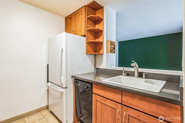 kitchen featuring dishwasher, open shelves, dark countertops, and a sink