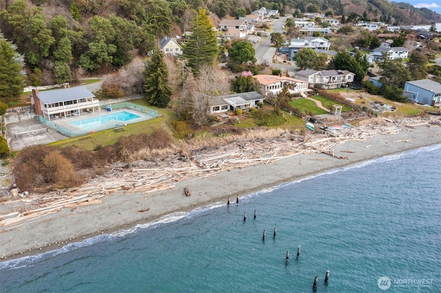 bird's eye view featuring a view of the beach and a water view