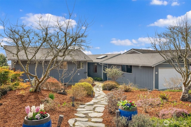 single story home featuring an attached garage